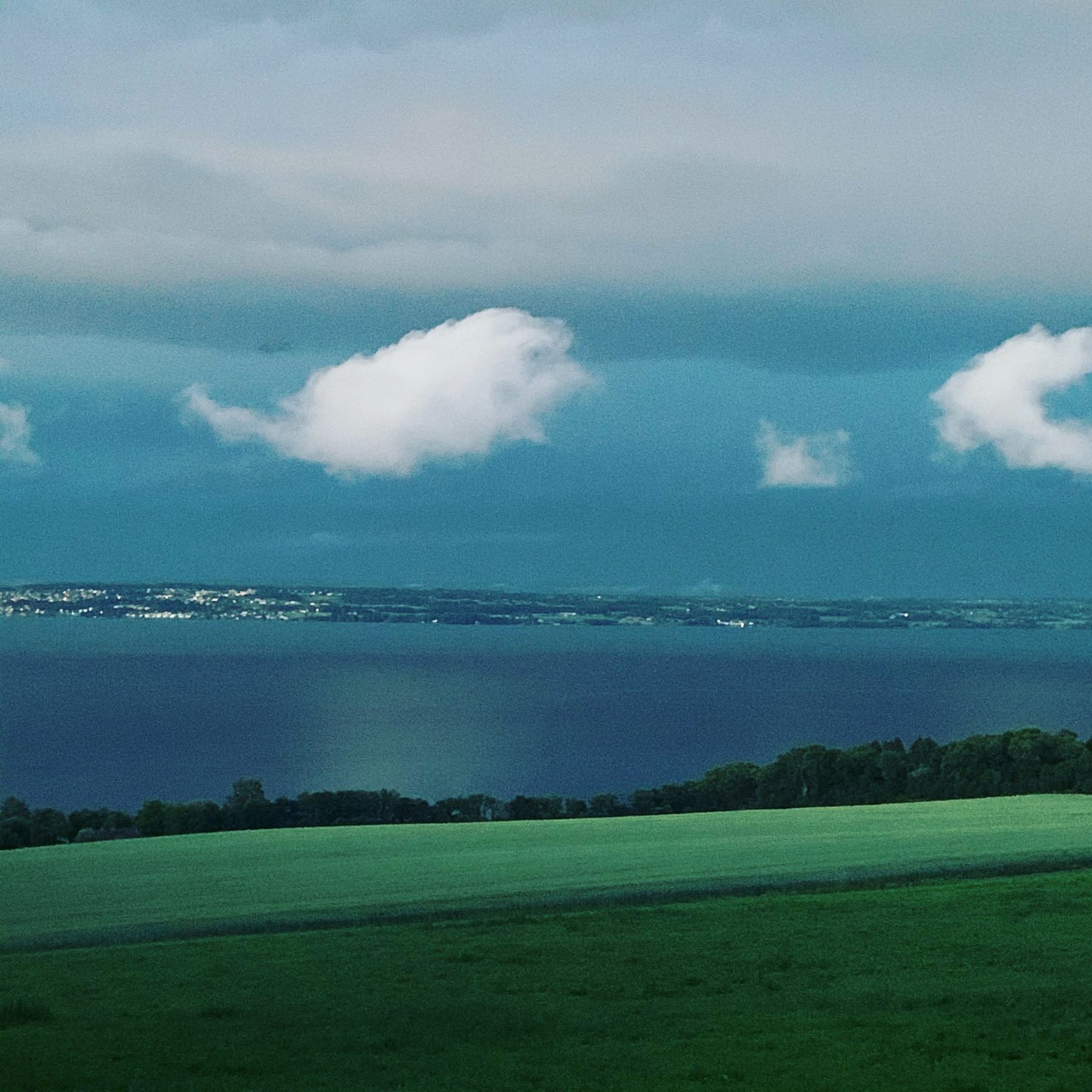 Mjøsa before a storm. Stange in the background
